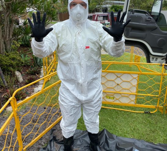 Man On Asbestos Removal Site — Fibre Optic Installation in Brisbane, QLD
